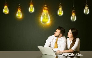Business couple with idea bulbs