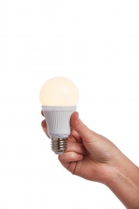 Hand holding bright led light bulb